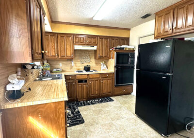 Kitchen view of 6510 Oak Forest Ct Fort Worth Duplex with phrase Live Property for Sale overlaid